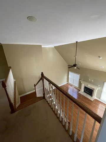 a view of staircase and utility room with stairs