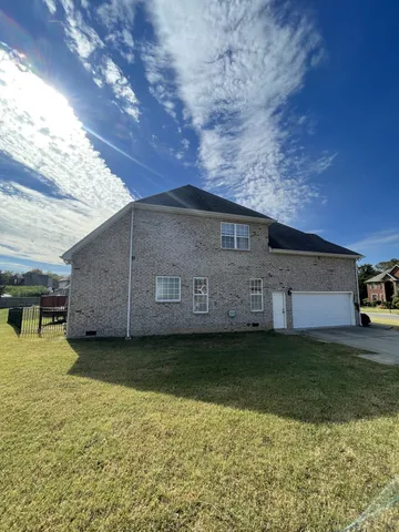 a backyard of a house with lots of green space
