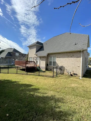 a view of a house with a big yard