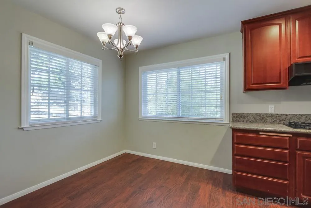 243 East View Street Fallbrook, CA 92028 - Photo 19 of 50 a view of a kitchen with a dishwasher cabinets and a window