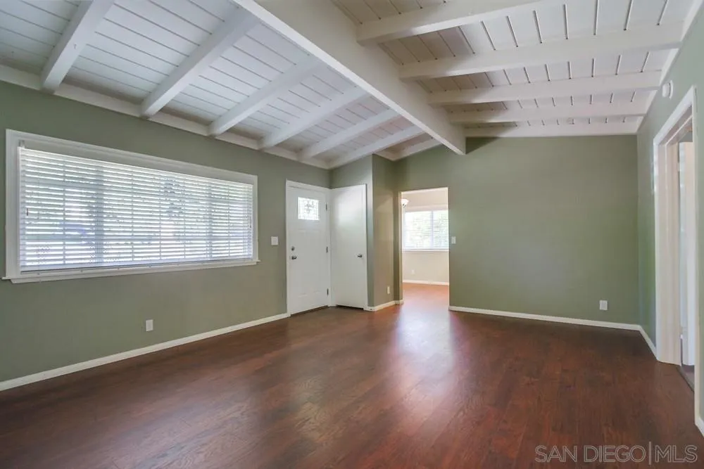 243 East View Street Fallbrook, CA 92028 - Photo 24 of 50 an empty room with wooden floor and windows