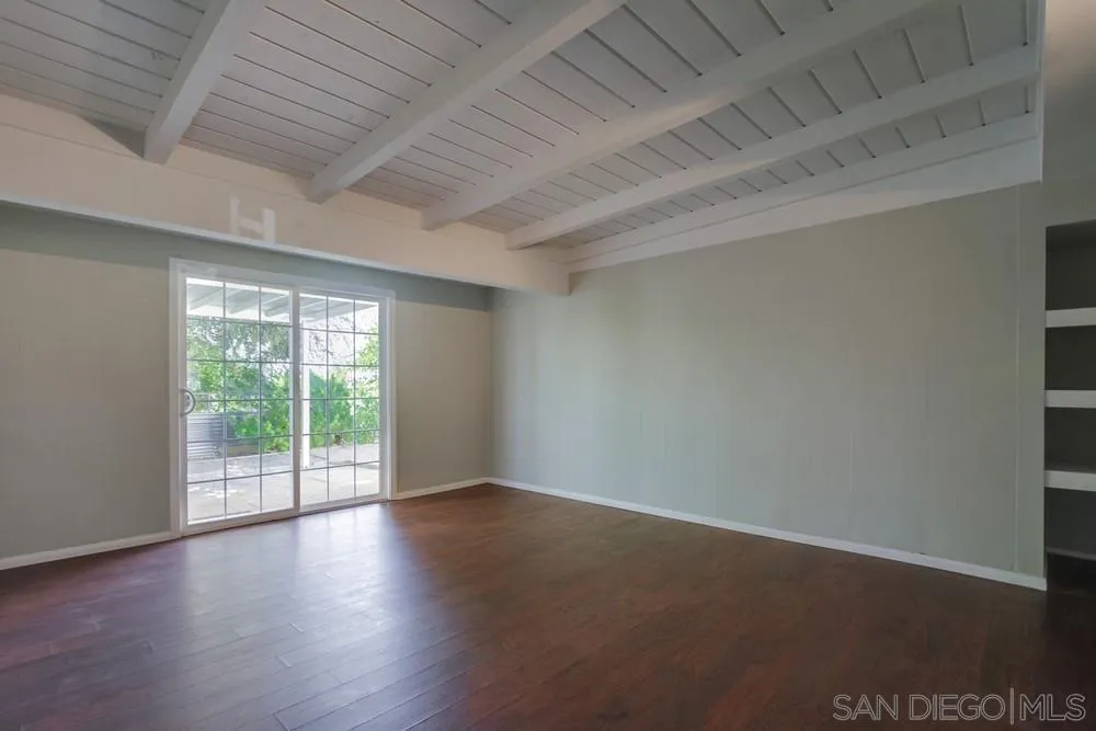 243 East View Street Fallbrook, CA 92028 - Photo 29 of 50 an empty room with wooden floor and windows