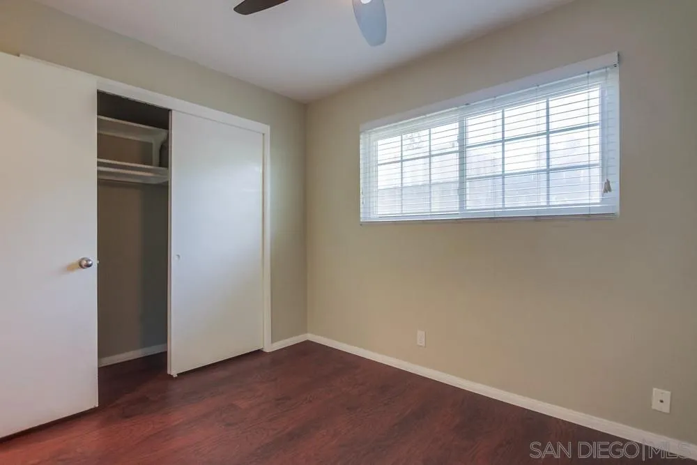 243 East View Street Fallbrook, CA 92028 - Photo 35 of 50 an empty room with wooden floor and windows