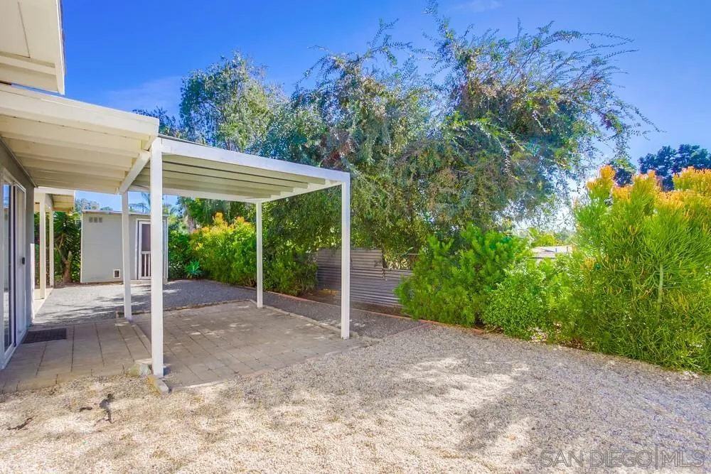 243 East View Street Fallbrook, CA 92028 - Photo 10 of 50 a view of a patio with table and chairs under an umbrella