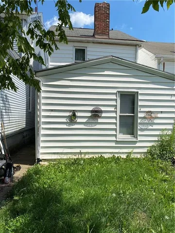 a view of a house with a small yard