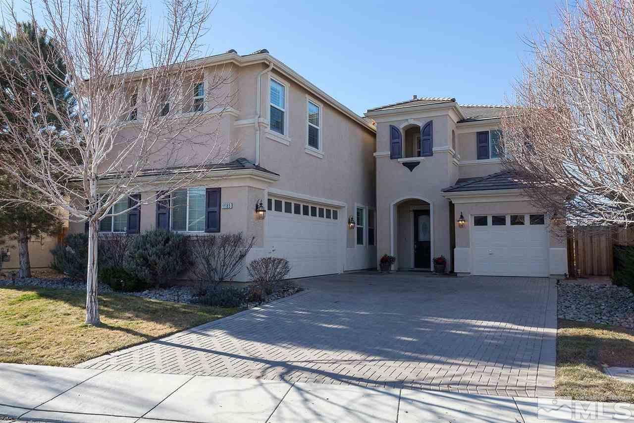 11185 Messina Way Reno, NV 89521 - Photo 1 of 1 a front view of a house with a yard and garage
