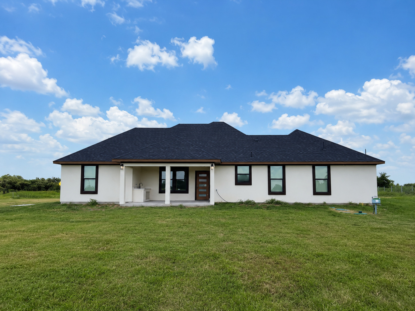 488 County Road 468 Elgin, TX 78621 - Photo 12 of 12 A well-maintained facade with ample yard space offers a peaceful setting for this residence.