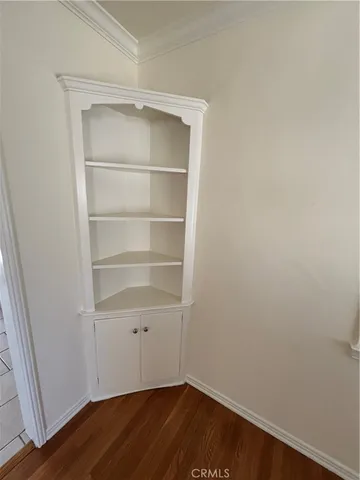 a view of a small space with wooden floor