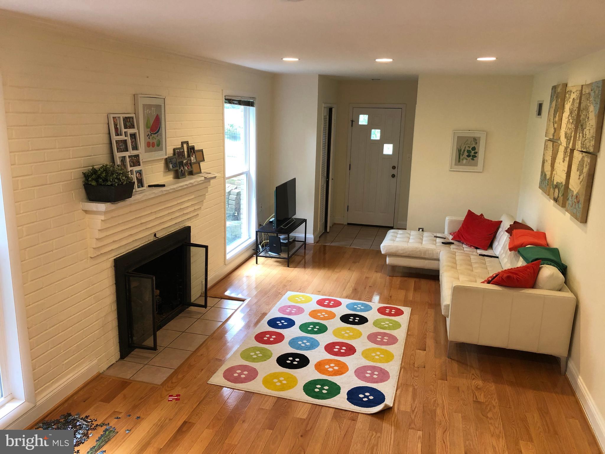 7701 Barnum Road Bethesda, MD 20817 - Photo 8 of 22 Family room w/ fireplace