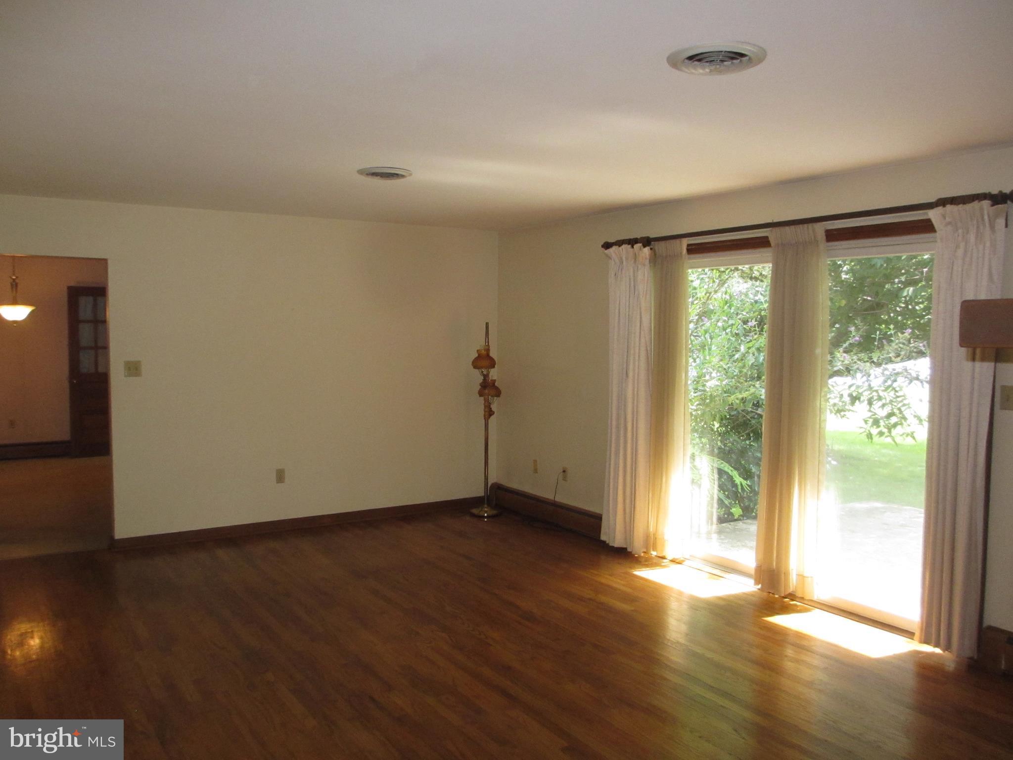 16 Nellies Corner Road Rising Sun, MD 21911 - Photo 14 of 25 a view of an empty room with wooden floor and a window