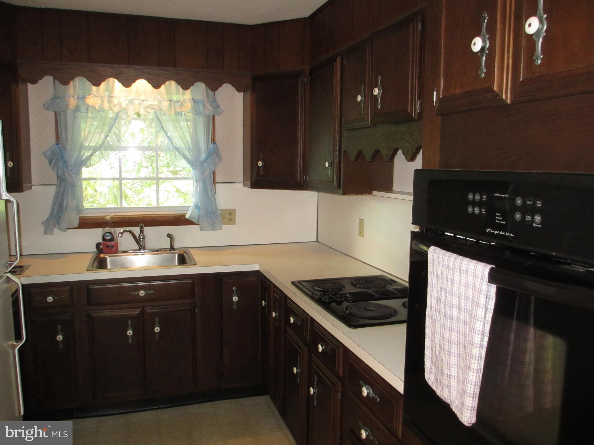 16 Nellies Corner Road Rising Sun, MD 21911 - Photo 21 of 25 a kitchen with a sink a stove and cabinets