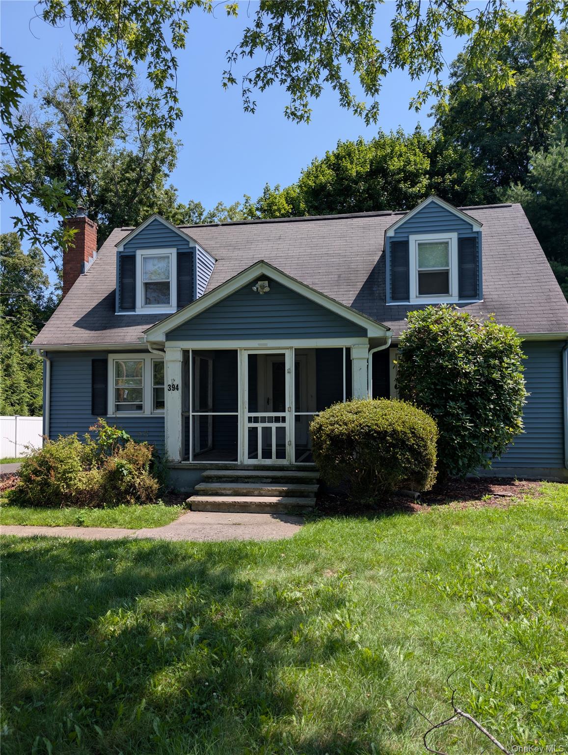 394 Riley Road, Unit 1 New Windsor, NY 12553 - Photo 1 of 24 Two-story rental features dormer windows, a screened-in front porch, and a sidewalk entrance