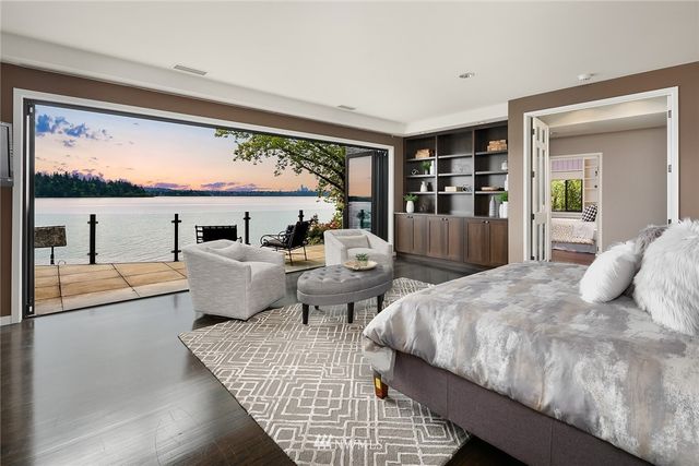 a view of a patio with table and chairs and potted plants