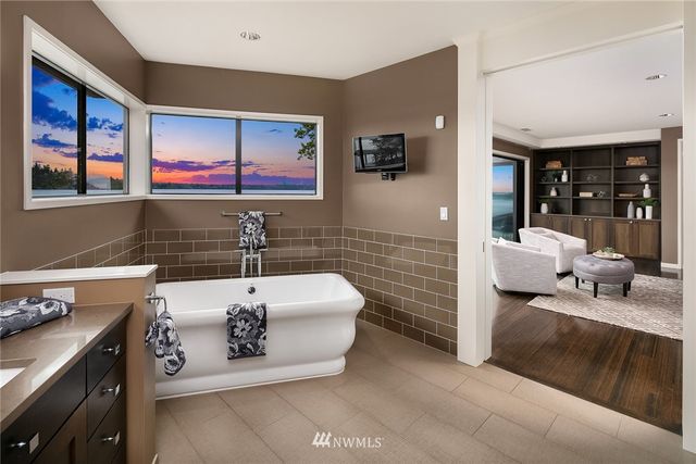 a bathroom with a sink a toilet and mirror