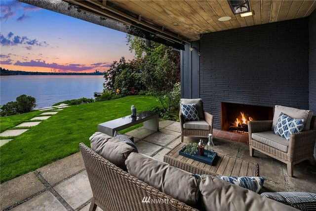 a view of a patio with couches chairs and a fire pit
