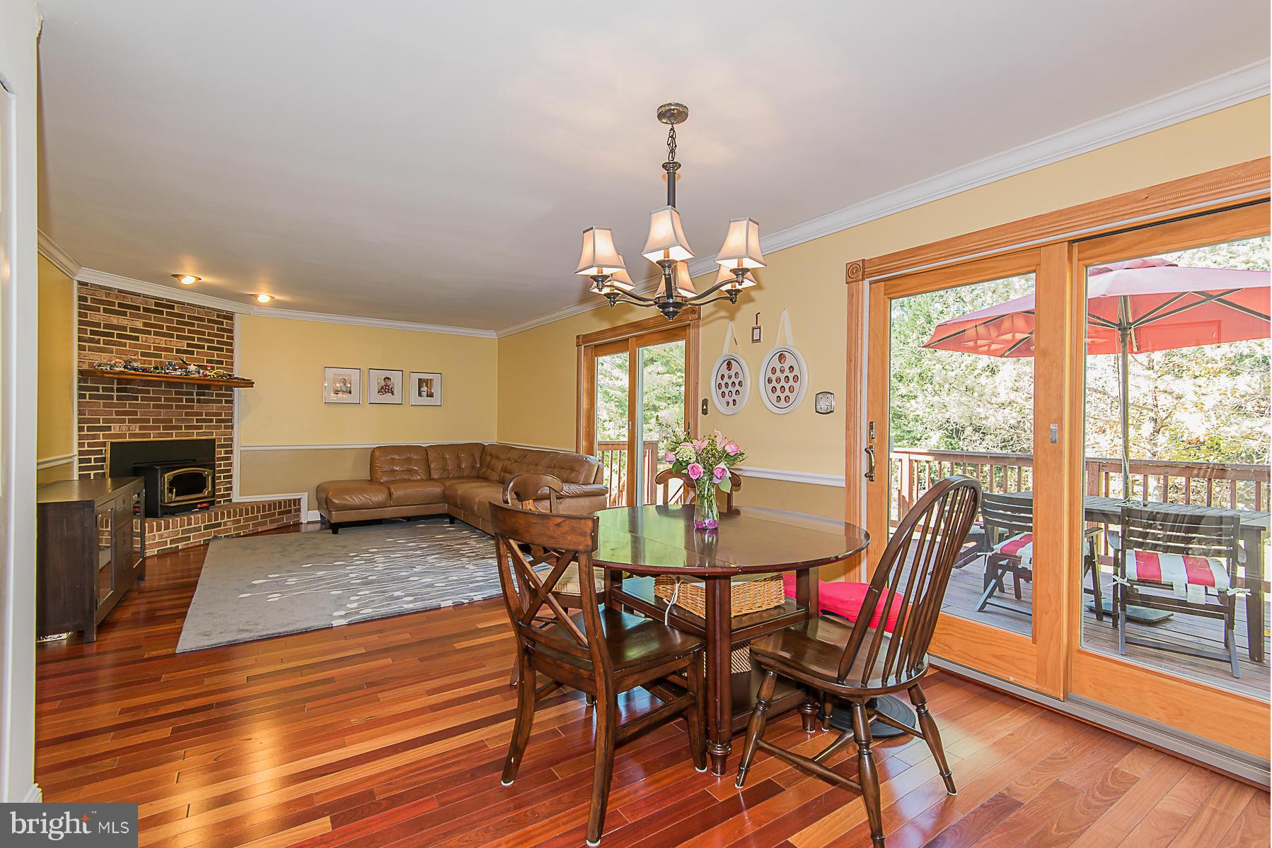 4050 Macalpine Road Ellicott City, MD 21042 - Photo 14 of 30 a view of a dining room with furniture window and wooden floor