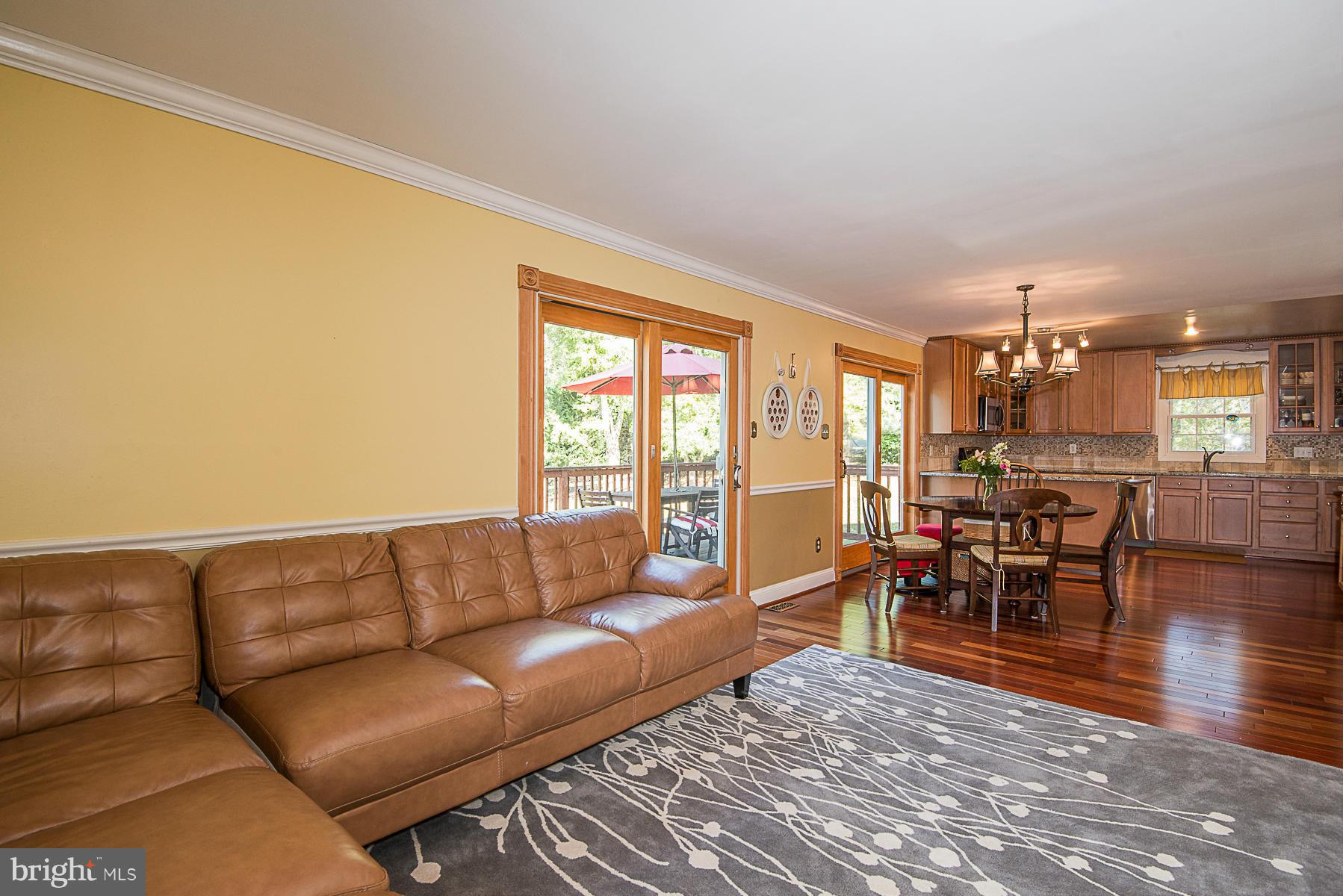 4050 Macalpine Road Ellicott City, MD 21042 - Photo 16 of 30 a living room with furniture and a dining table with kitchen view