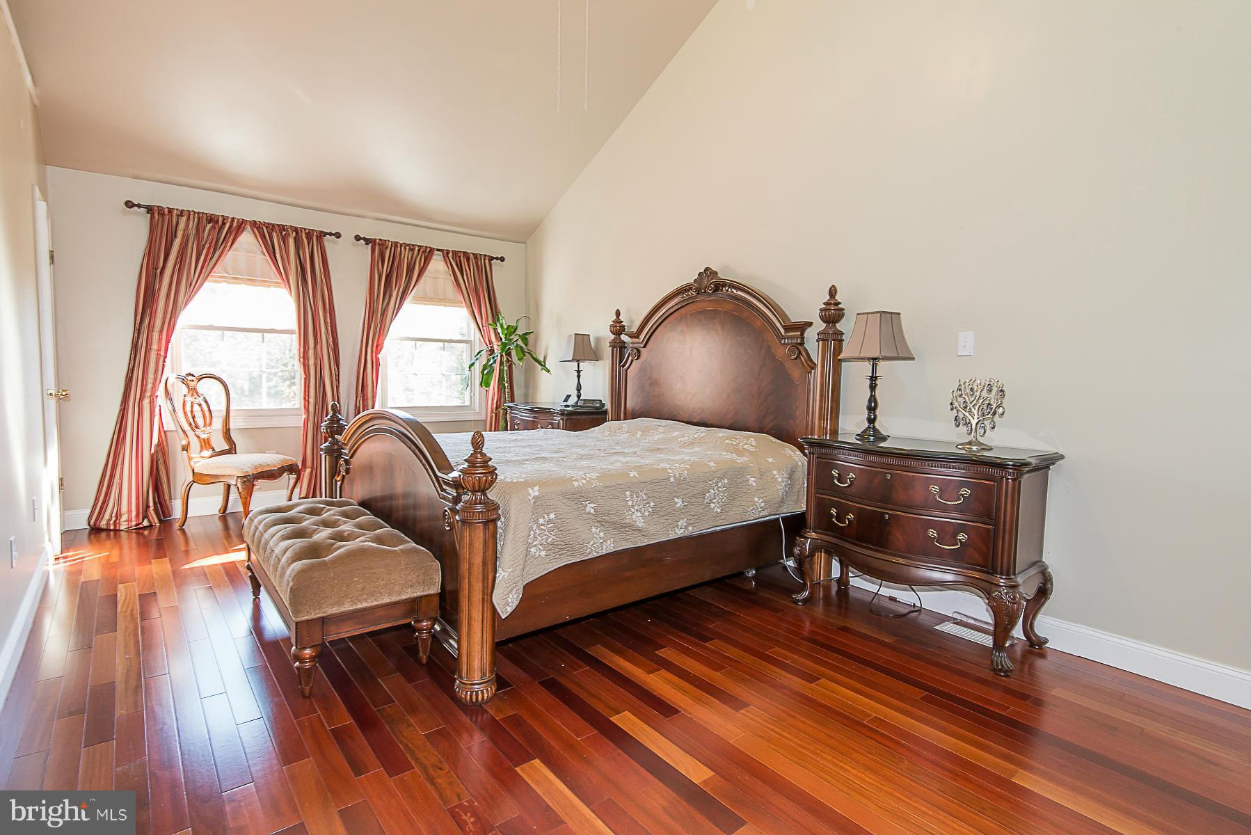 4050 Macalpine Road Ellicott City, MD 21042 - Photo 17 of 30 a bedroom with furniture and wooden floor