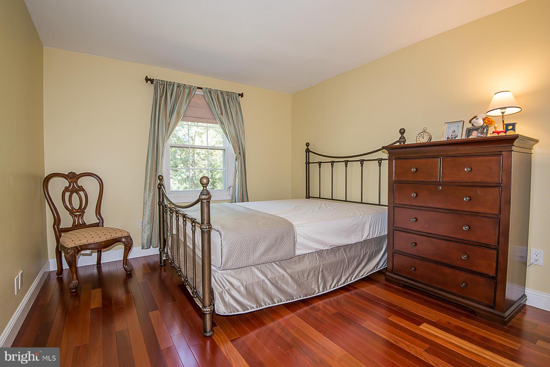 4050 Macalpine Road Ellicott City, MD 21042 - Photo 21 of 30 a bedroom with a bed and a window