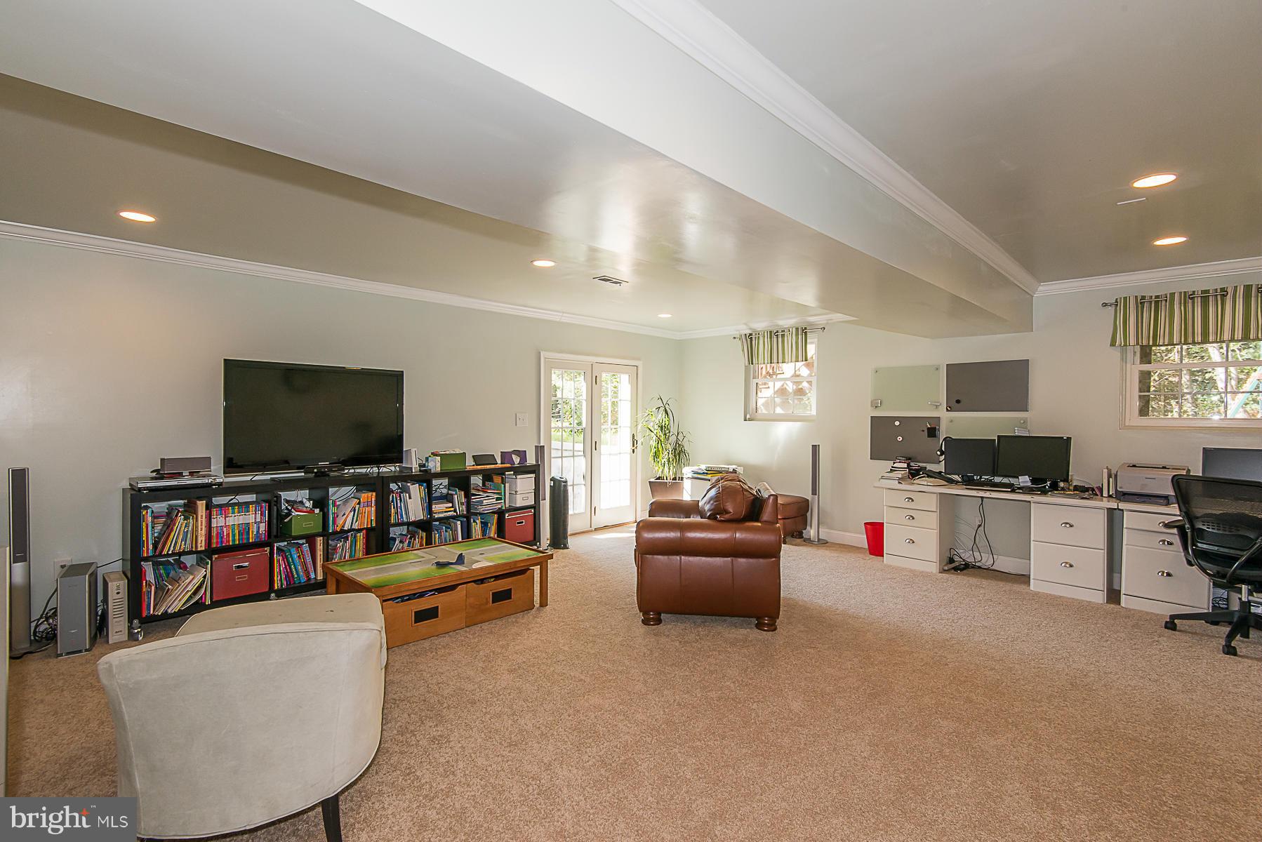 4050 Macalpine Road Ellicott City, MD 21042 - Photo 25 of 30 a living room with furniture and a flat screen tv
