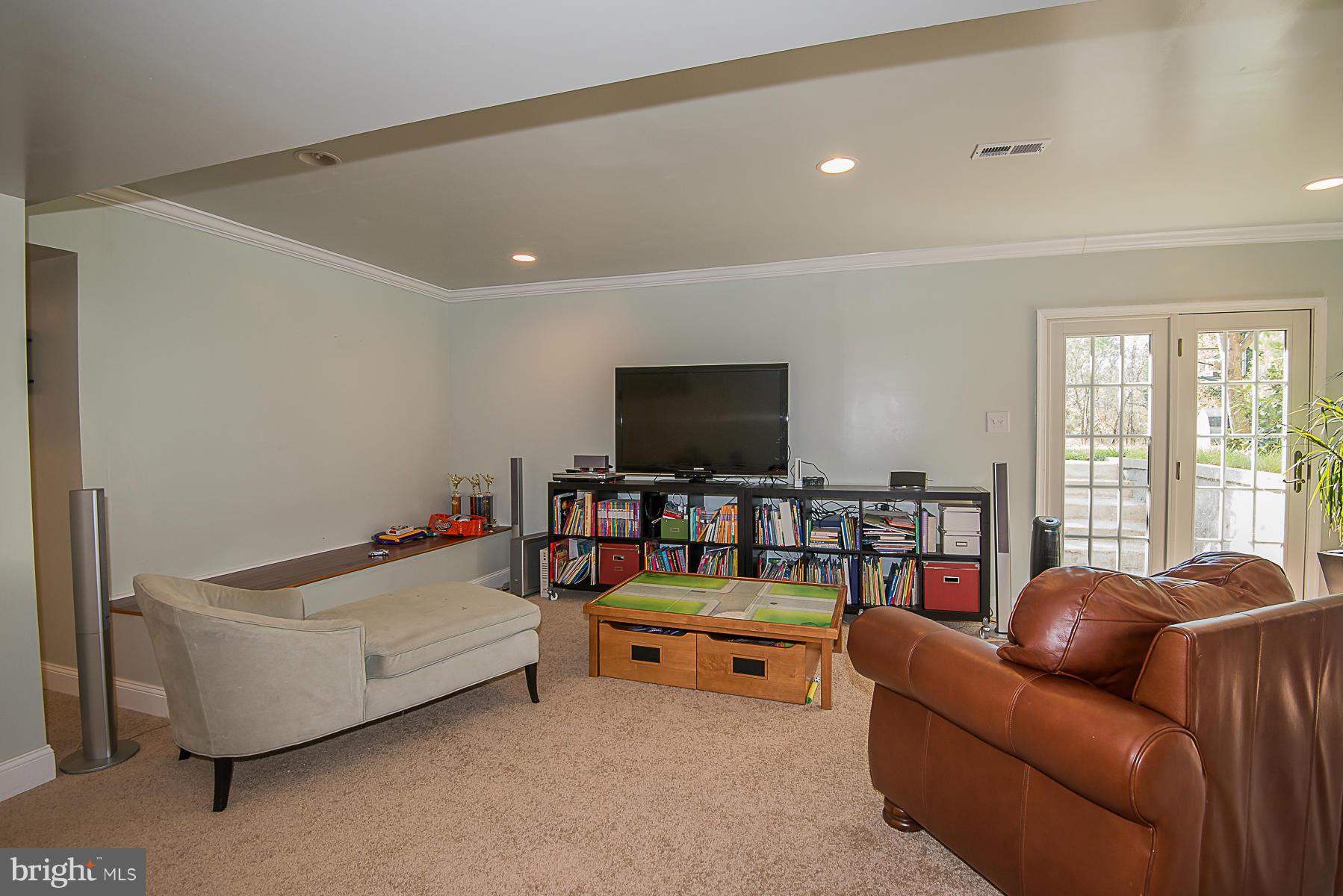 4050 Macalpine Road Ellicott City, MD 21042 - Photo 26 of 30 a living room with furniture and a flat screen tv