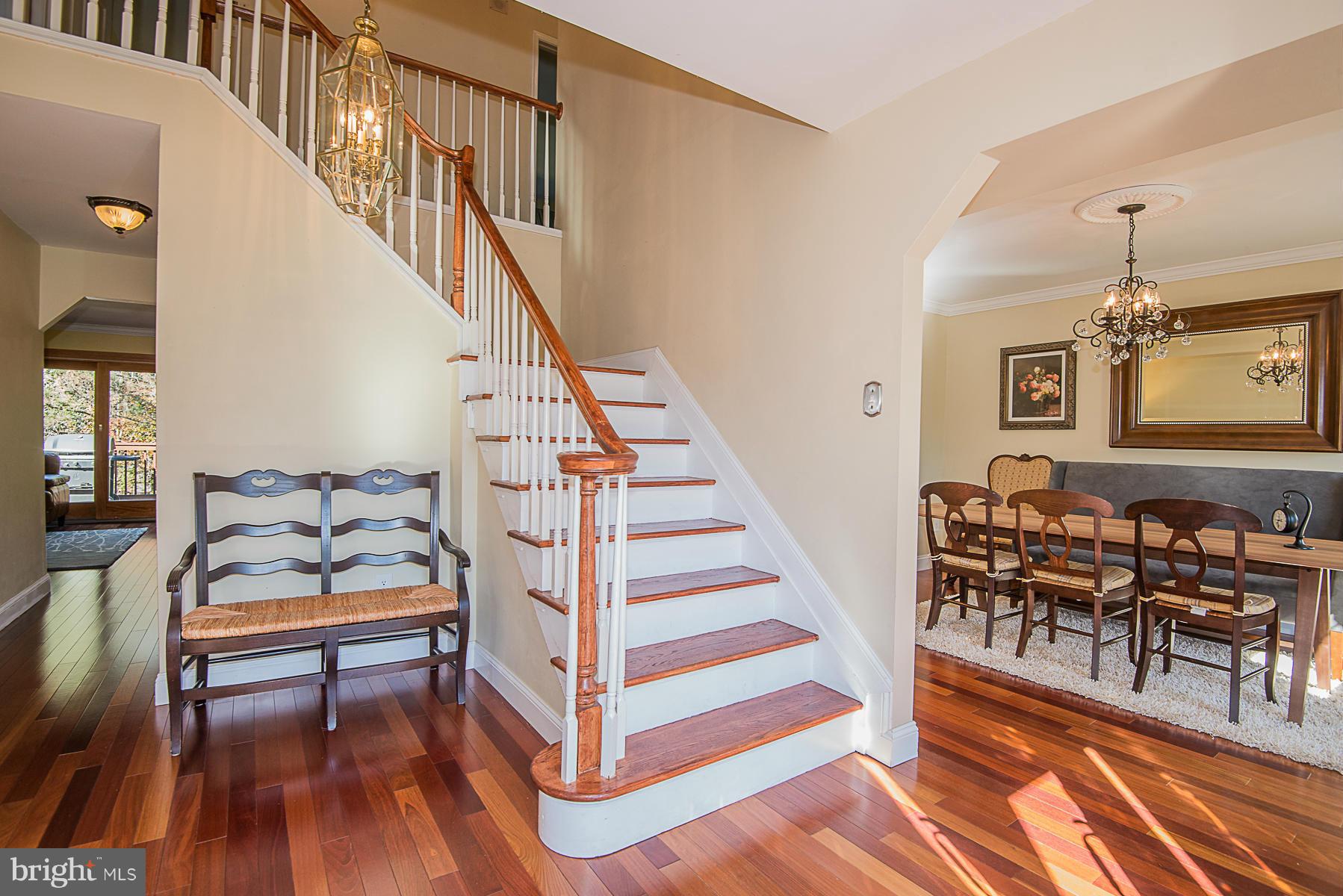 4050 Macalpine Road Ellicott City, MD 21042 - Photo 5 of 30 a bedroom with wooden floor and a bed
