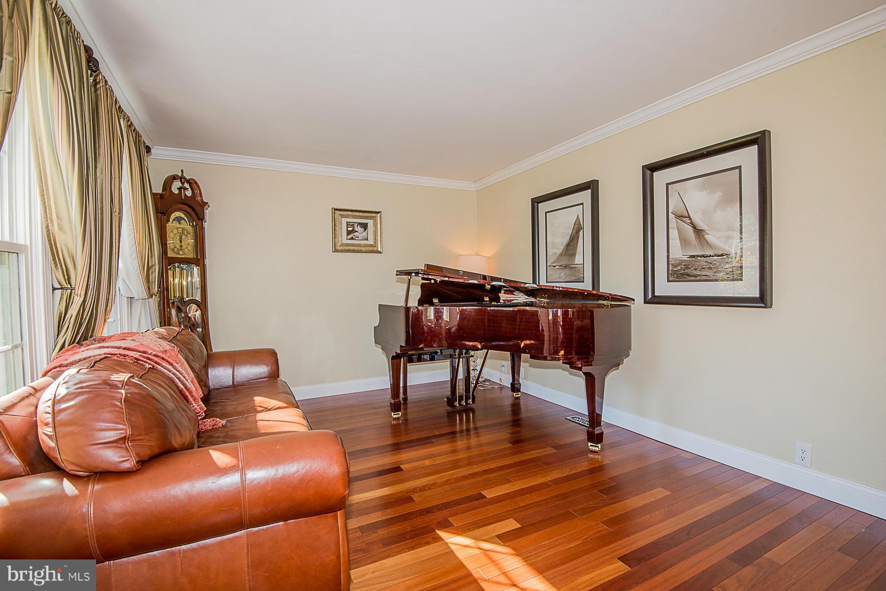 4050 Macalpine Road Ellicott City, MD 21042 - Photo 6 of 30 a living room with furniture and a wooden floor