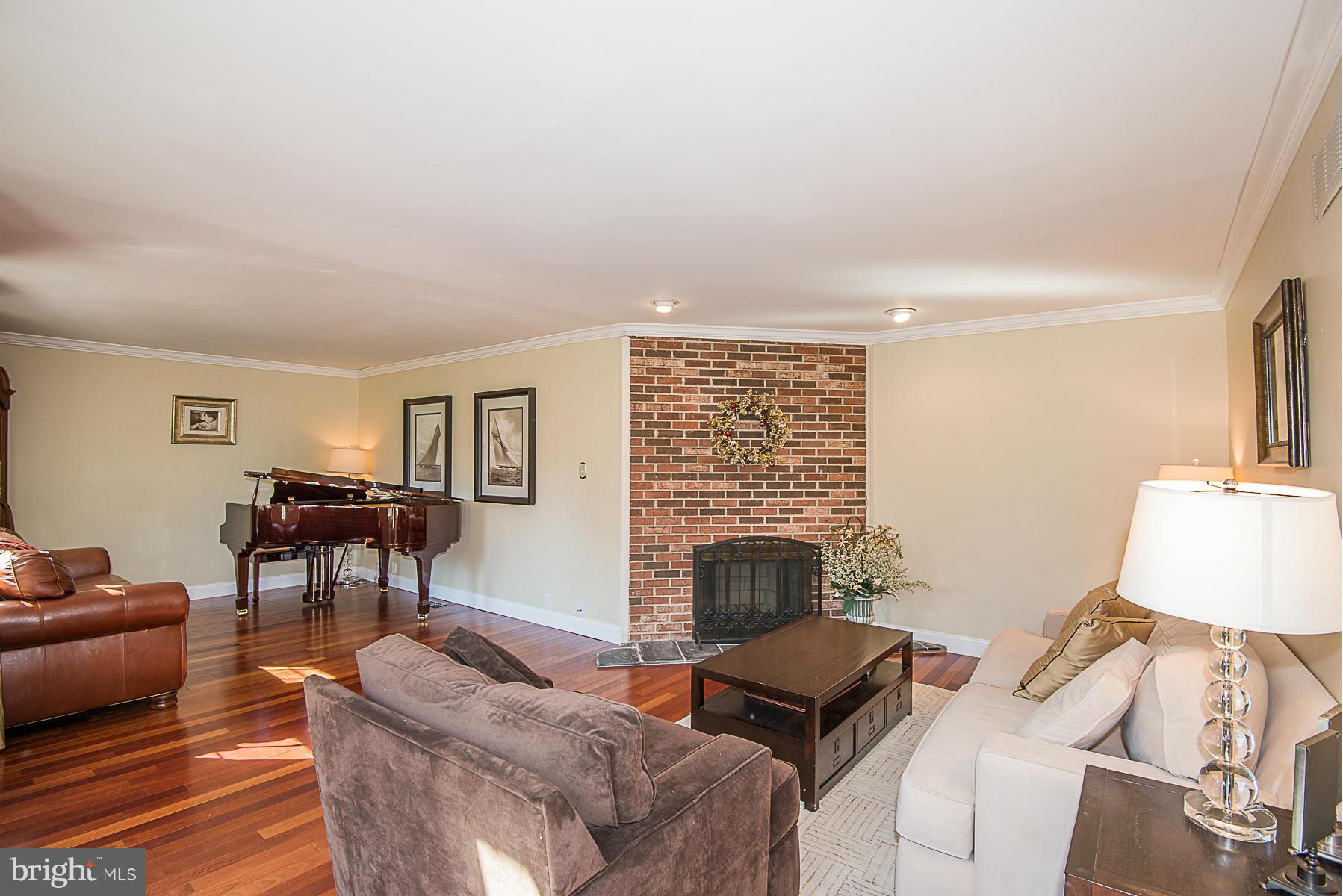 4050 Macalpine Road Ellicott City, MD 21042 - Photo 7 of 30 a living room with furniture and a fireplace