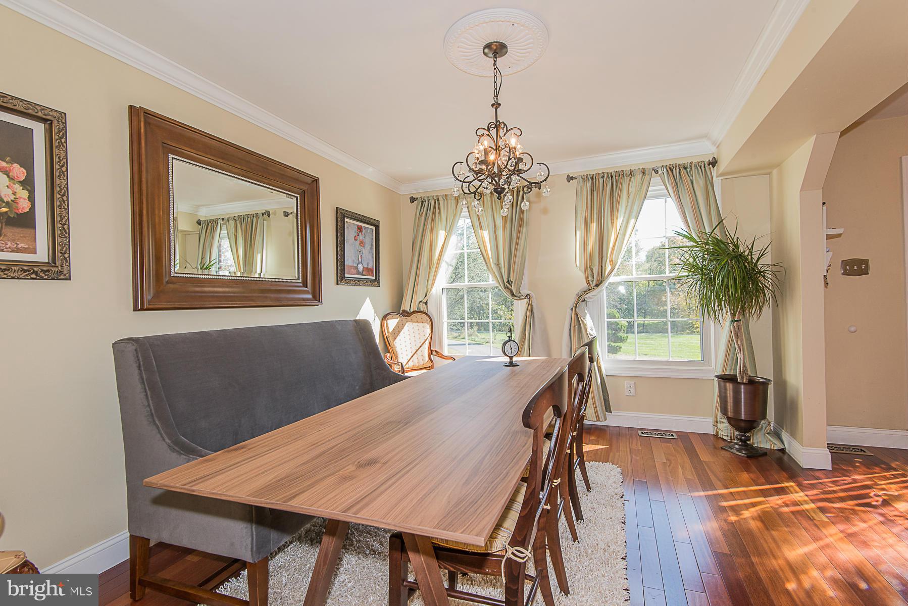 4050 Macalpine Road Ellicott City, MD 21042 - Photo 9 of 30 a view of a dining room with furniture window and wooden floor