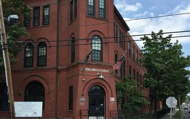 a brick building with a sign on it