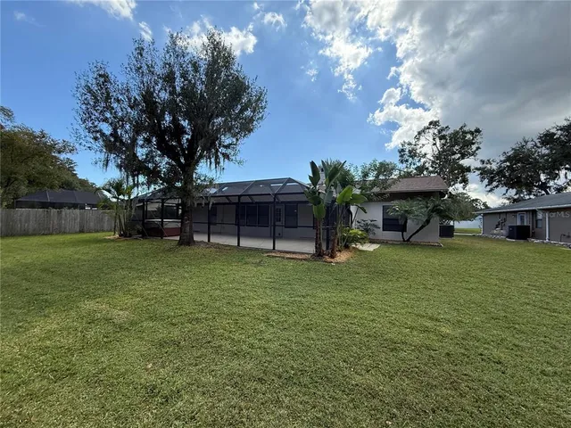 a view of a house with backyard
