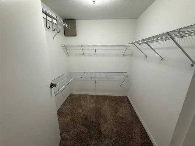 a bathroom with a sink toilet and mirror