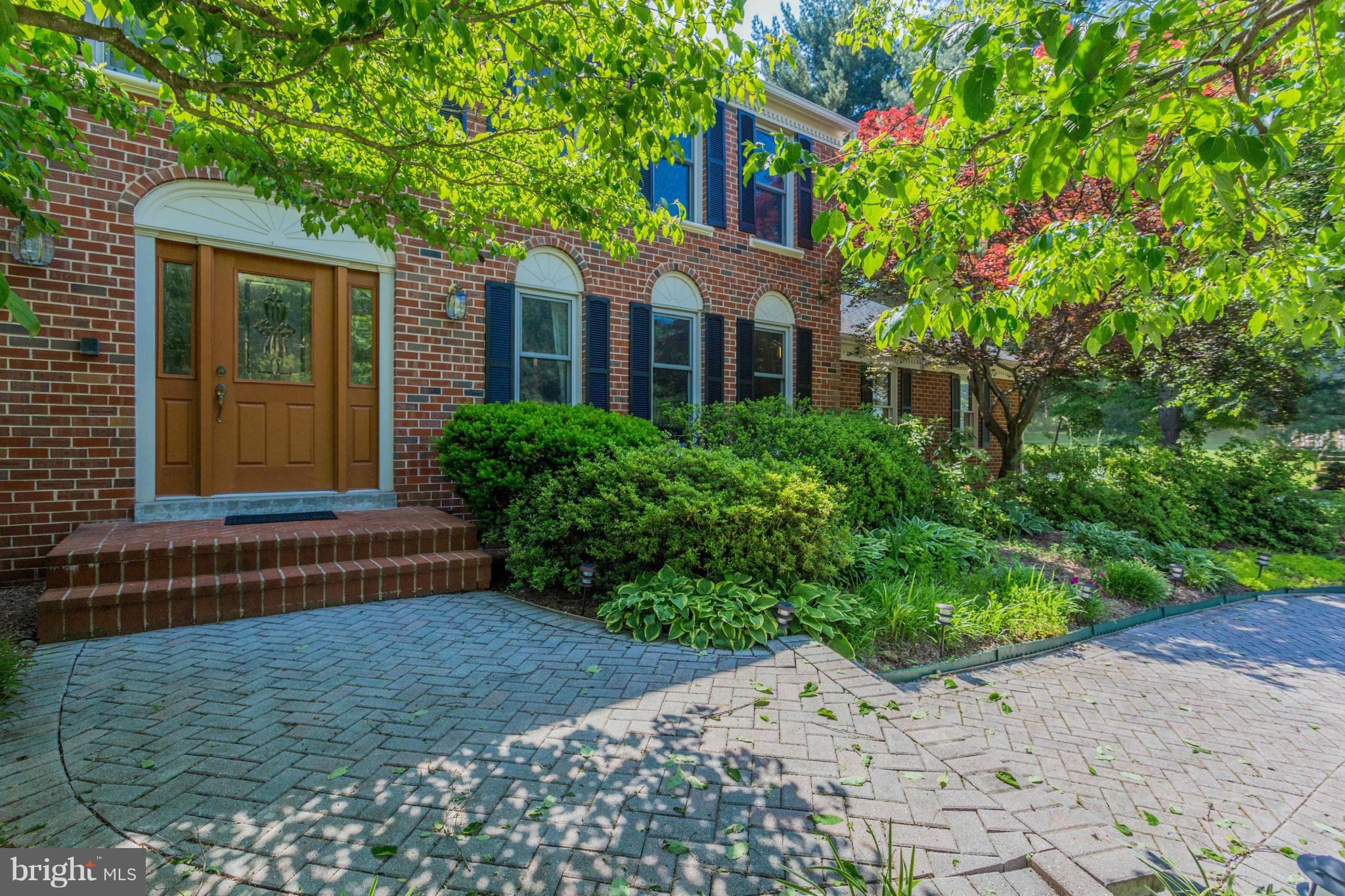 Professional Landscaping and Paved Brick Walkway