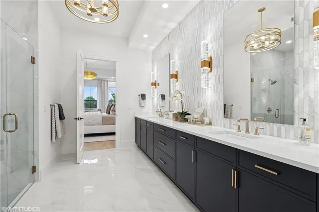 a spacious bathroom with a double vanity sink and a mirror