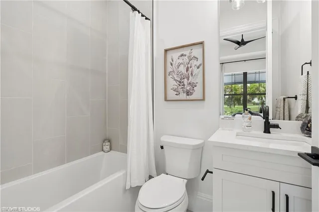 a bathroom with a sink toilet and bathtub