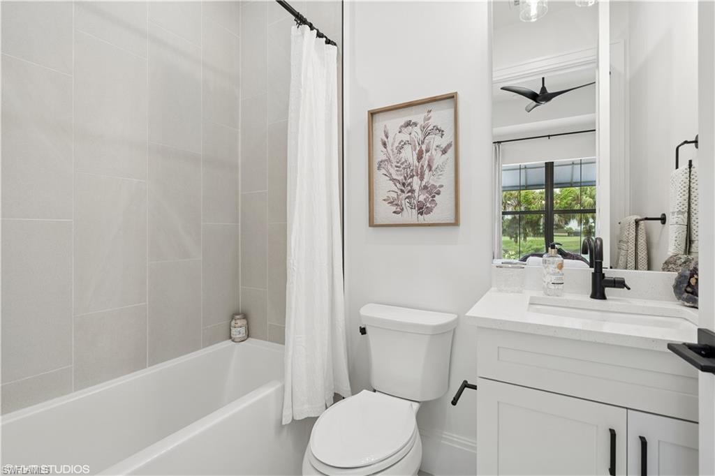 19781 Marino Lake Circle, Unit B4102 Miromar Lakes, FL 33913 - Photo 39 of 43 a bathroom with a sink toilet and bathtub