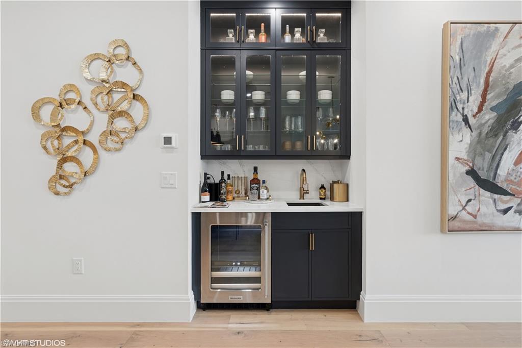19781 Marino Lake Circle, Unit B4102 Miromar Lakes, FL 33913 - Photo 7 of 43 a bathroom with a sink and a mirror