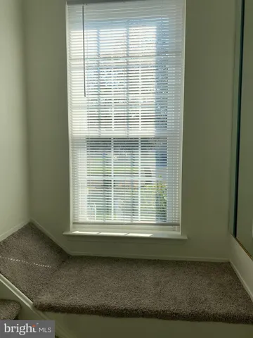 a view of a room that has a window in it