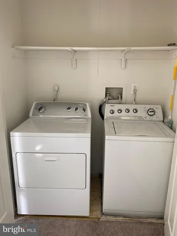 a view of a hallway with entryway and window