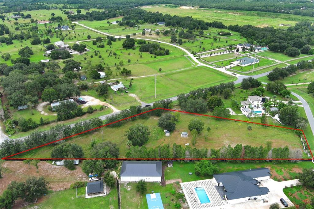 34534 Tree Frog Lane Eustis, FL 32736 - Photo 11 of 17 an aerial view of a residential houses with outdoor space and street view