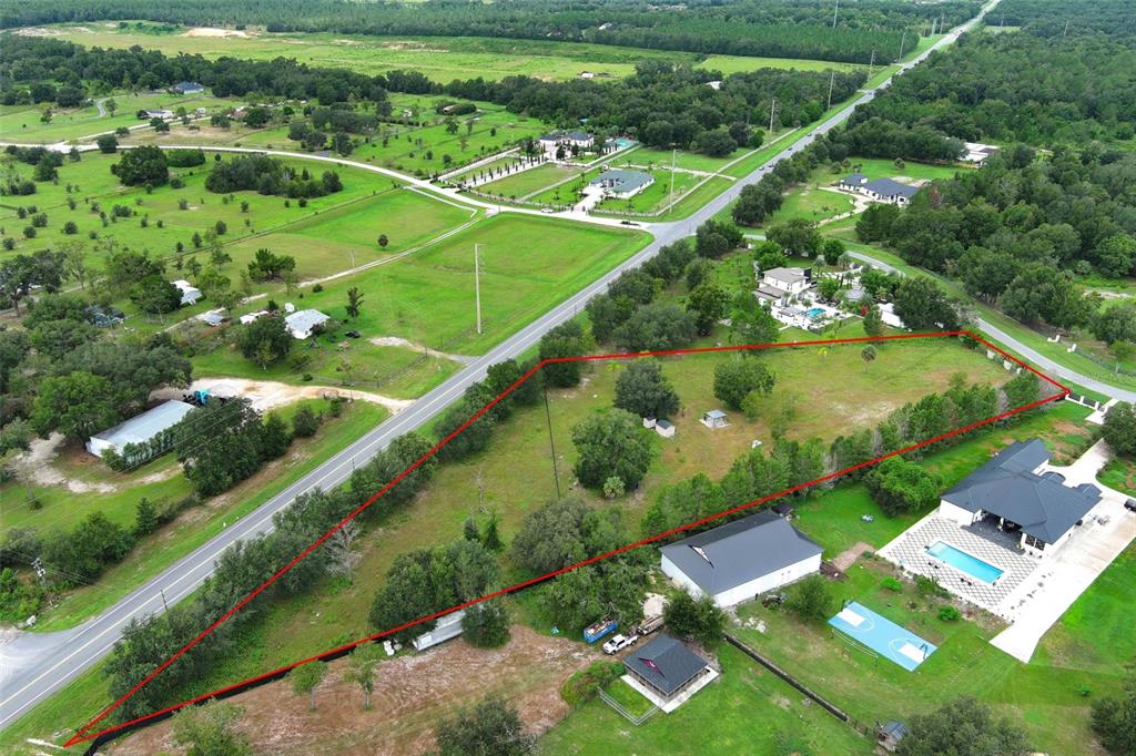 34534 Tree Frog Lane Eustis, FL 32736 - Photo 12 of 17 an aerial view of a pool yard swimming pool and outdoor seating