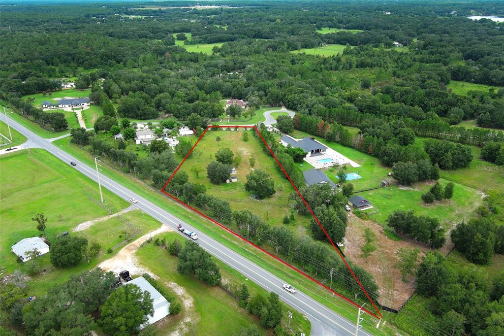 34534 Tree Frog Lane Eustis, FL 32736 - Photo 14 of 17 a view of a garden with a lake