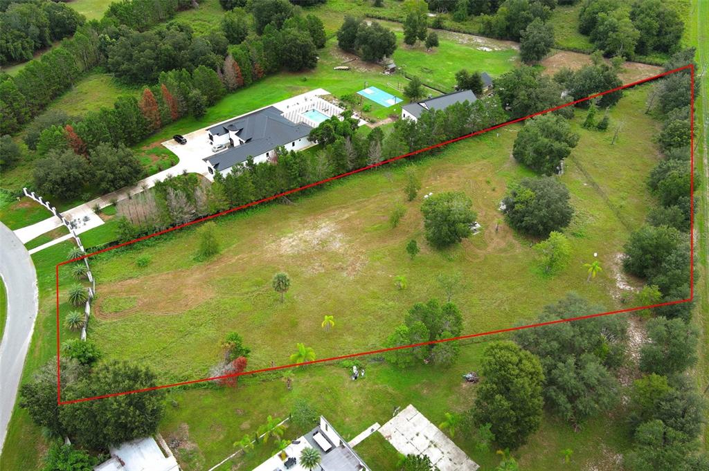 34534 Tree Frog Lane Eustis, FL 32736 - Photo 17 of 17 an aerial view of a residential houses with outdoor space and street view
