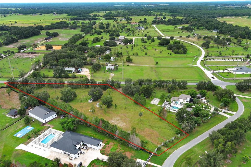 34534 Tree Frog Lane Eustis, FL 32736 - Photo 9 of 17 an aerial view of a residential houses with outdoor space and street view