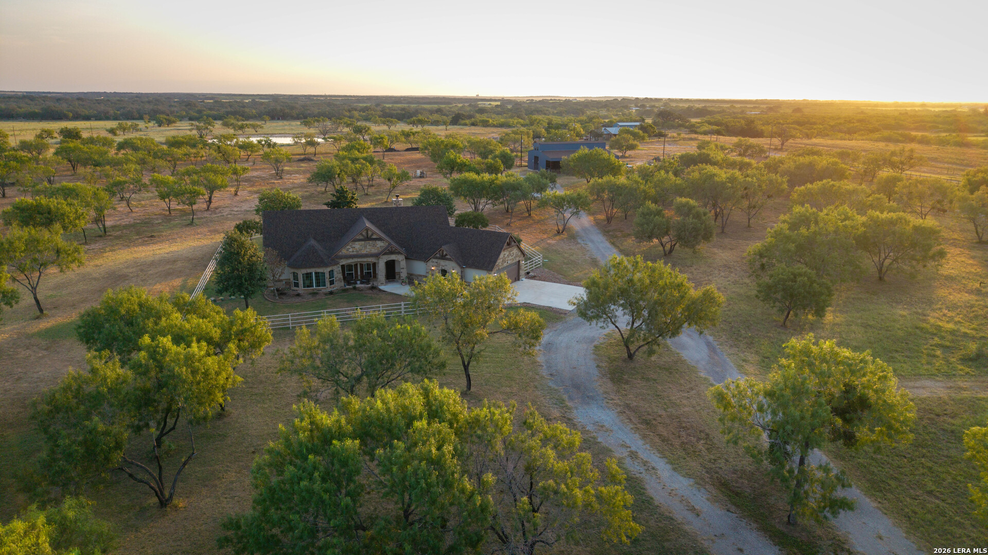 5002 Fm 476 Poteet, TX 78065 - Photo 16 of 50 an aerial view of residential houses with outdoor space and trees