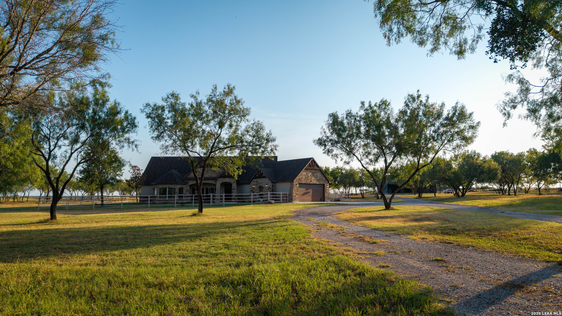5002 Fm 476 Poteet, TX 78065 - Photo 20 of 50 a view of a swimming pool with a house in the background
