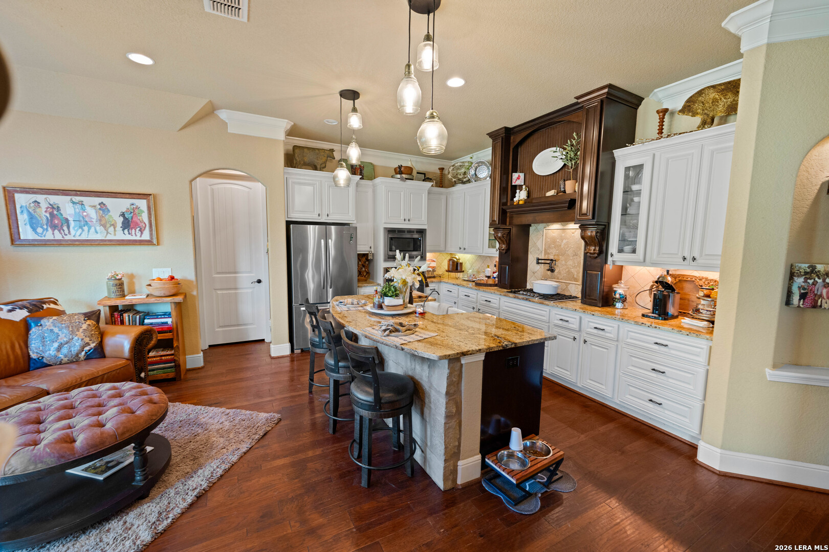 5002 Fm 476 Poteet, TX 78065 - Photo 35 of 50 a living room with furniture kitchen view and a wooden floor
