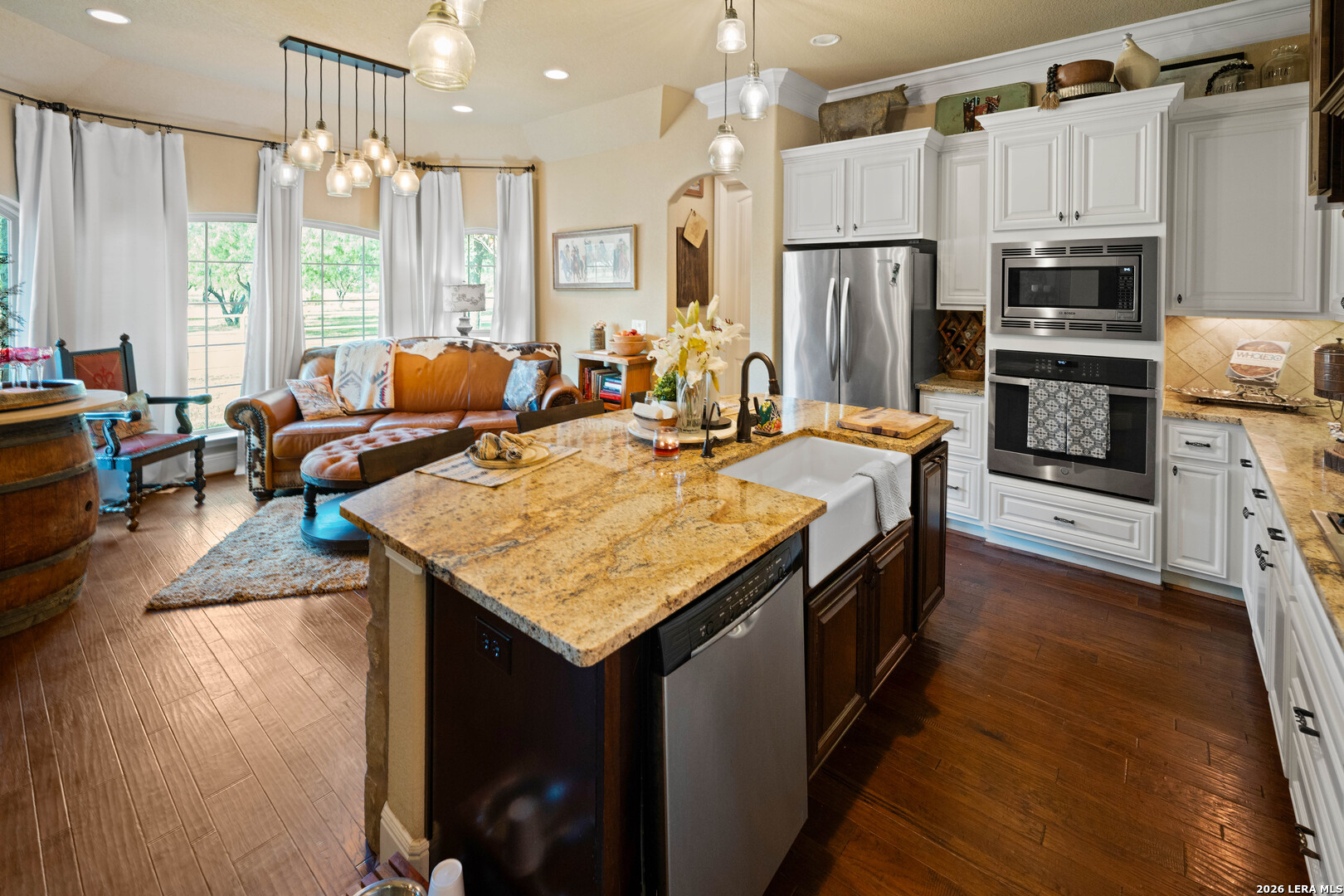 5002 Fm 476 Poteet, TX 78065 - Photo 39 of 50 a kitchen with sink a refrigerator and chairs