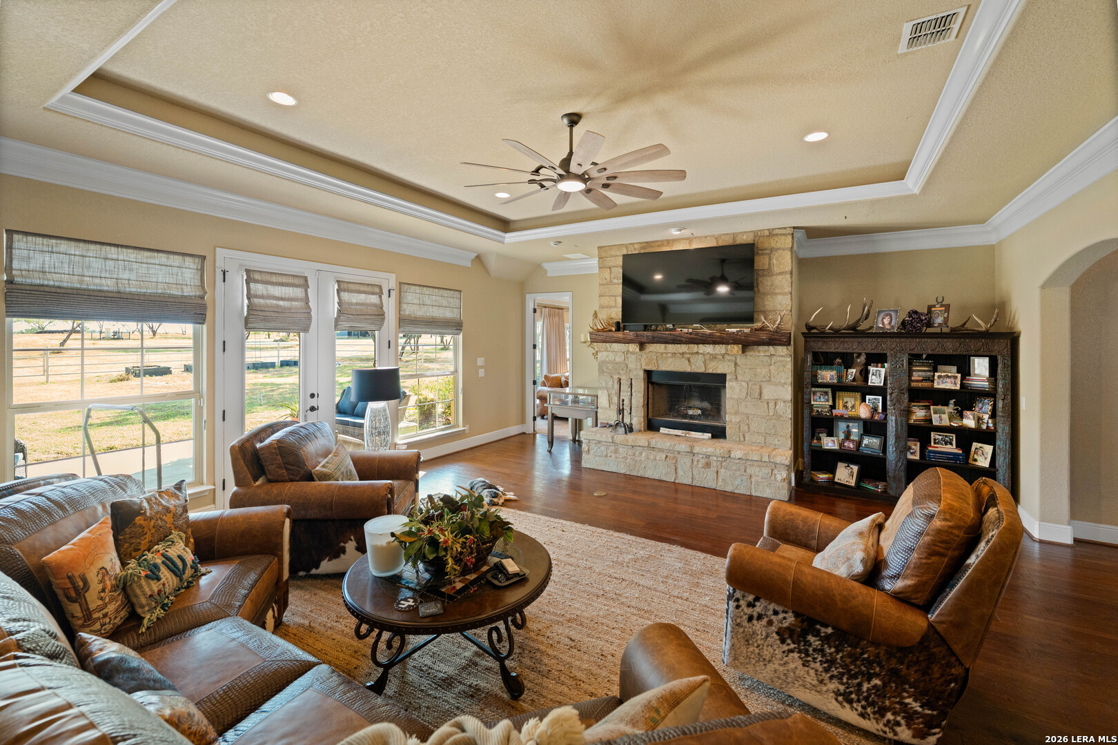 5002 Fm 476 Poteet, TX 78065 - Photo 40 of 50 a living room with furniture a fireplace and a flat screen tv