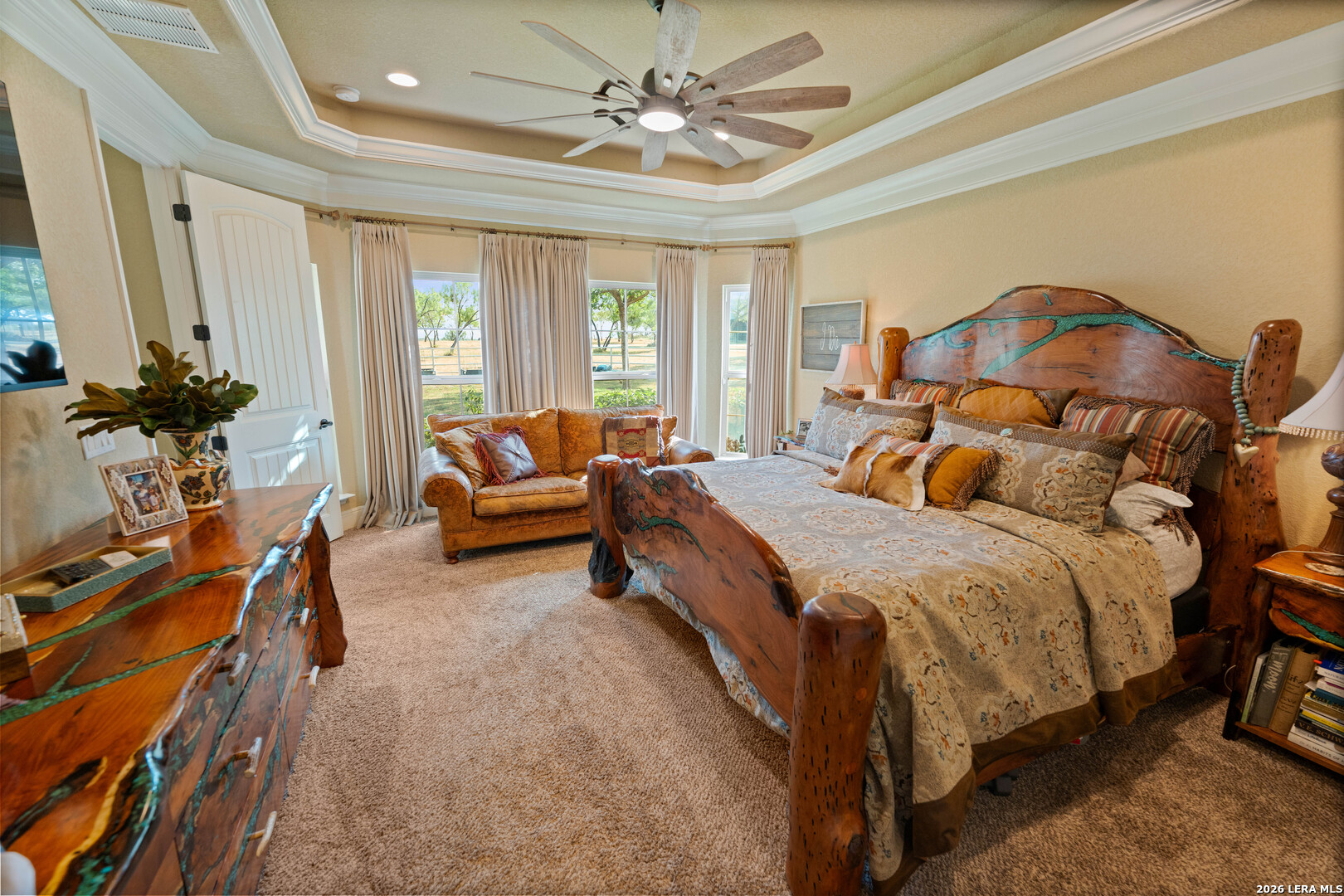 5002 Fm 476 Poteet, TX 78065 - Photo 43 of 50 a bedroom with a bed and a chandelier
